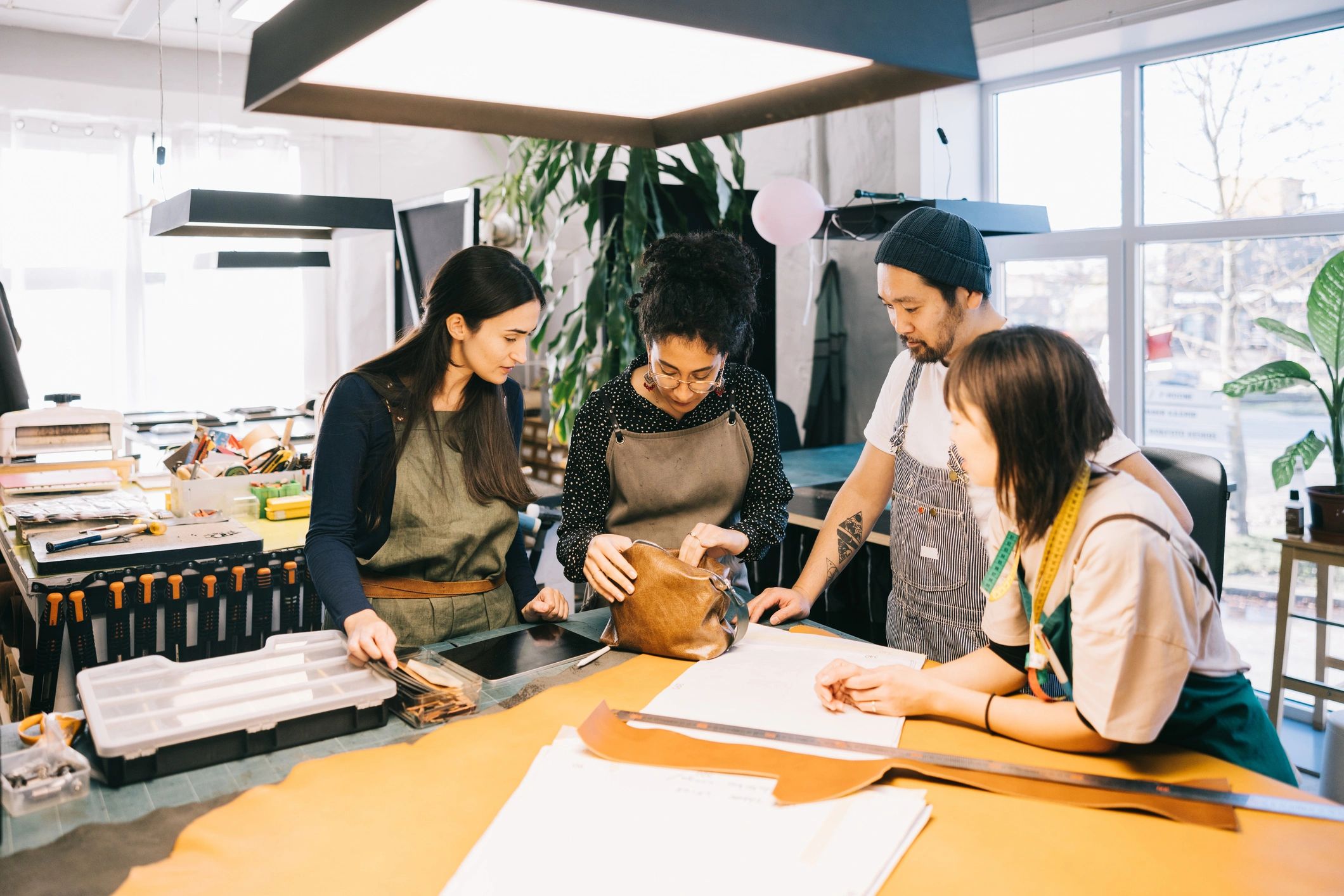 Design team collaborating on product development in a studio