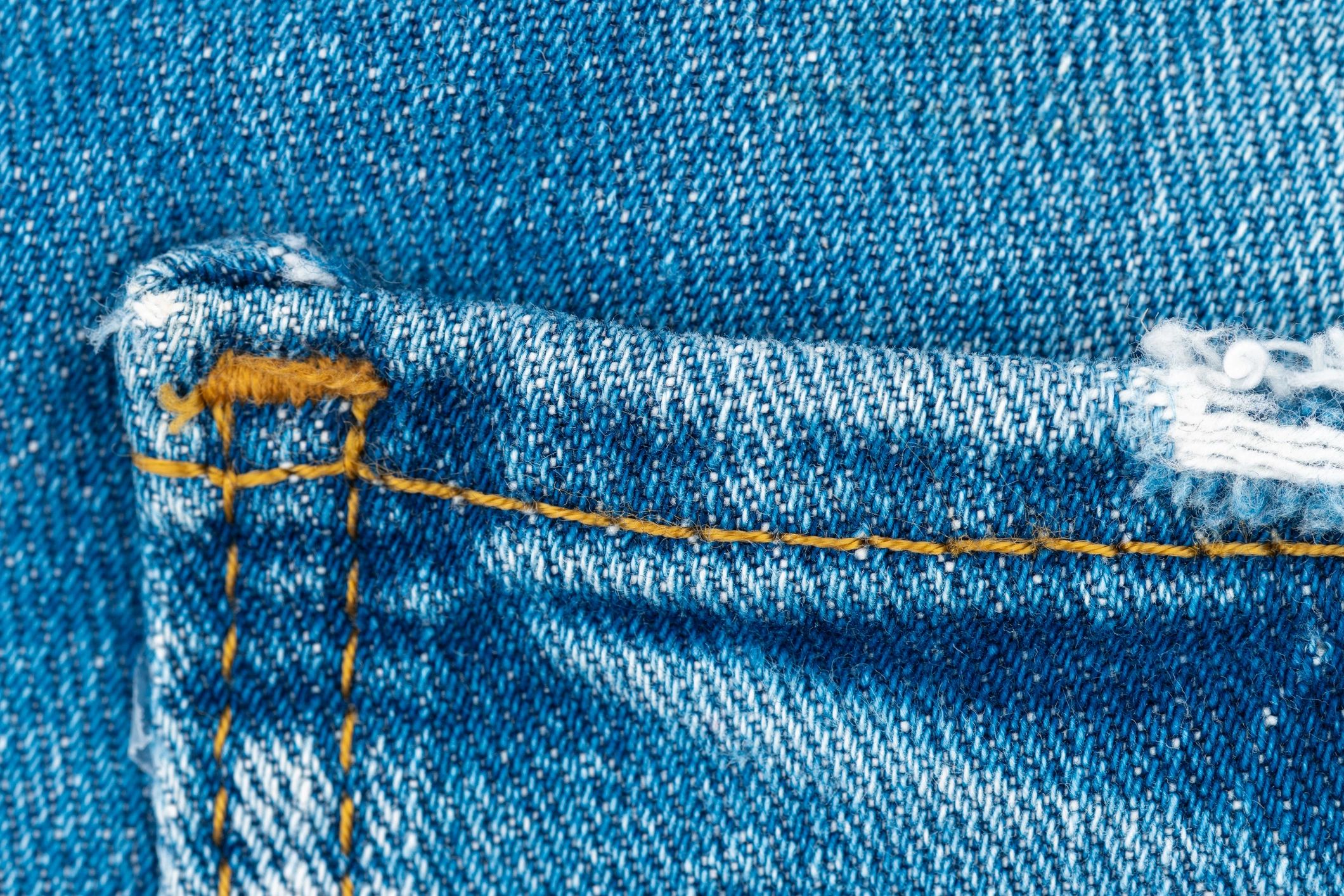 Close-up detail of premium denim stitching and fabric texture